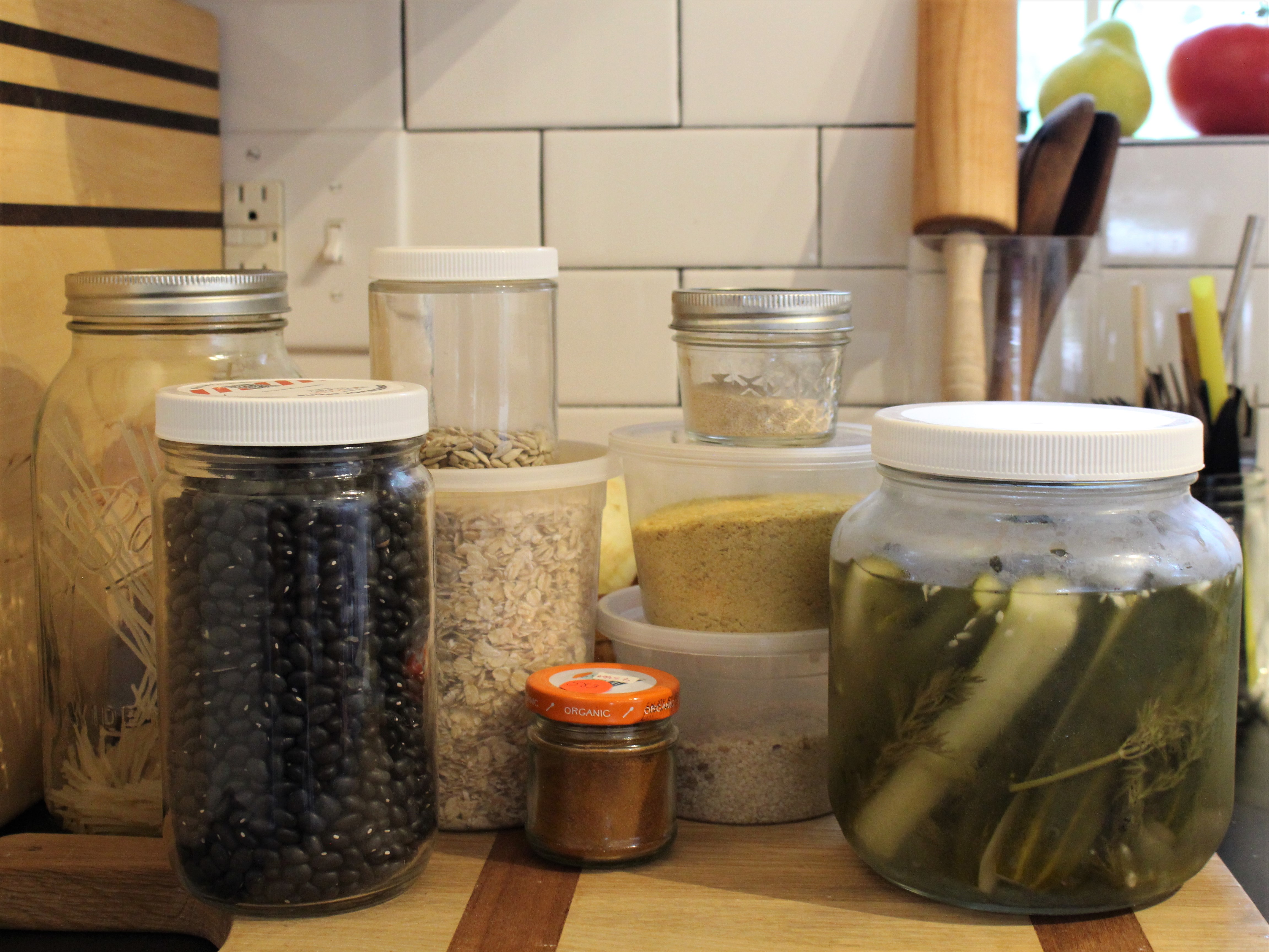 Nine reusable containers in a kitchen