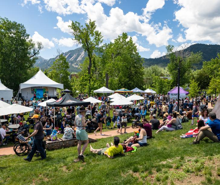 Community members visiting vendor tents at Boulder Creek Festival