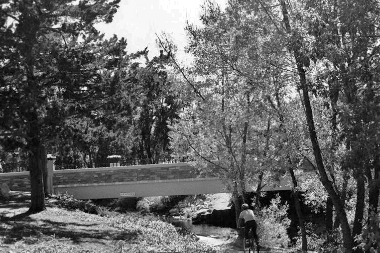 A cyclist rides up the new bike path under Arapahoe Avenue in 1988.