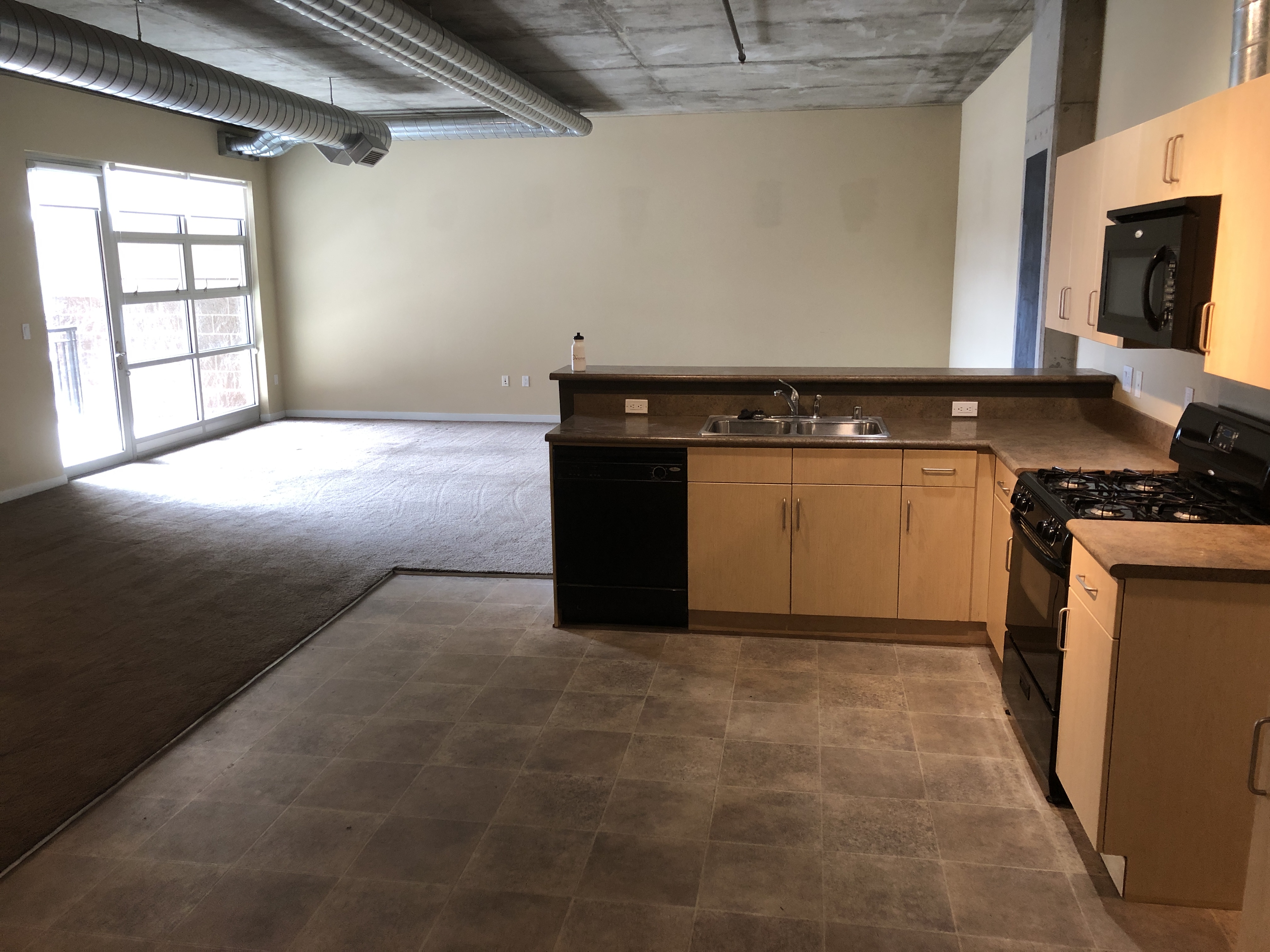 3601 Arapahoe Ave Unit 225 - kitchen looking on to living room