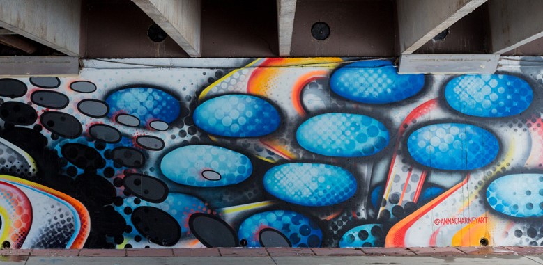 Colorful mural wall located in an underpass