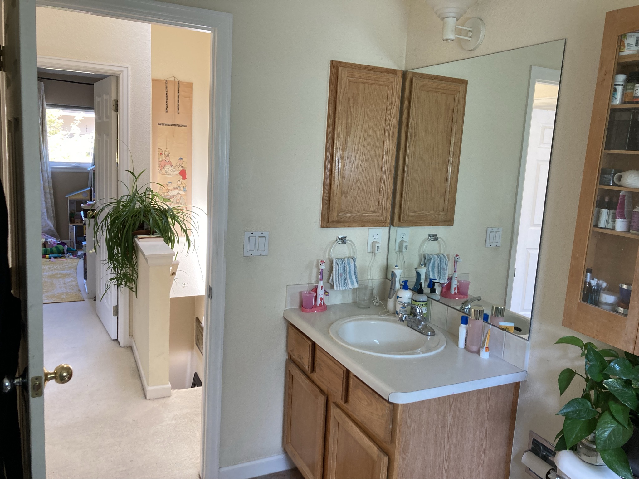 11. 1460 Quince Ave 103 - bathroom sink looking to hallway
