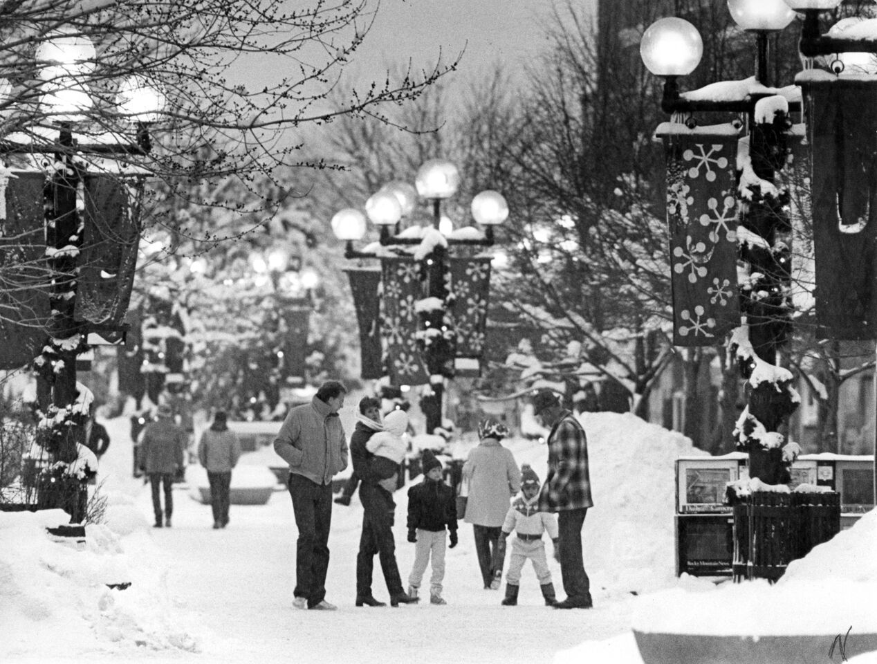 People enjoying a snowy street