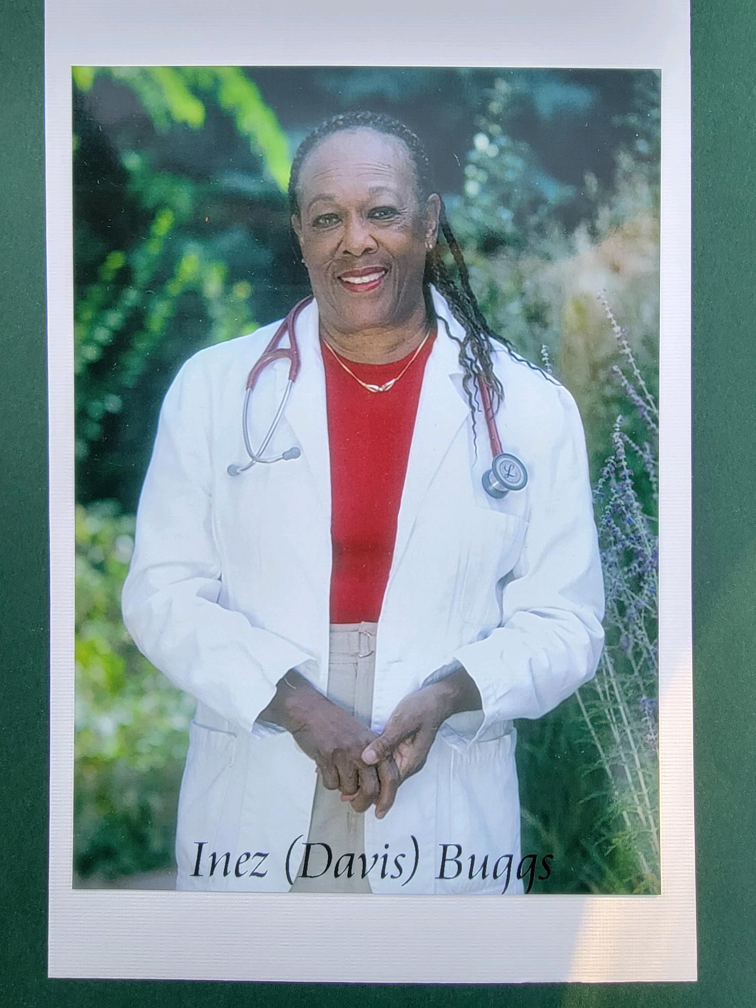 Inez (Davis) Buggs portrait in a white lab coat and stethoscope, wearing a red shirt underneath
