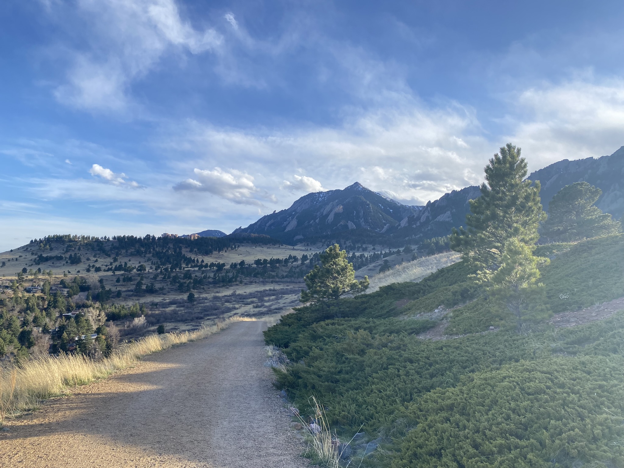 Wide trail with Flatirons in the distance