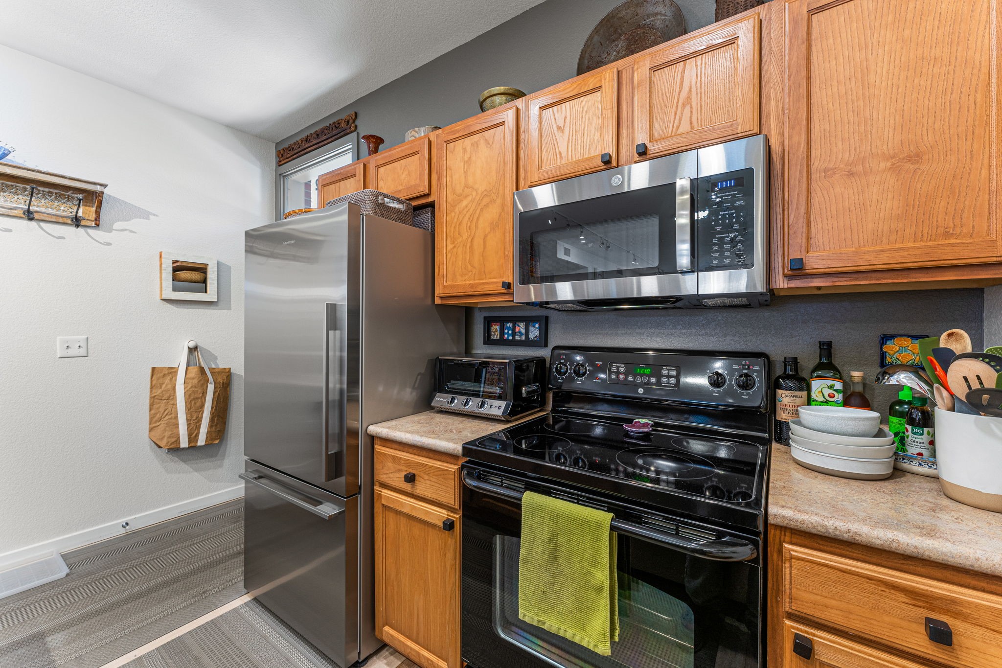 Kitchen view stove view and fridge
