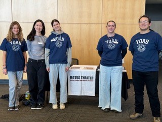 Four members of YOAB tabling with the YOP manager at an event at Motus Theatre. 