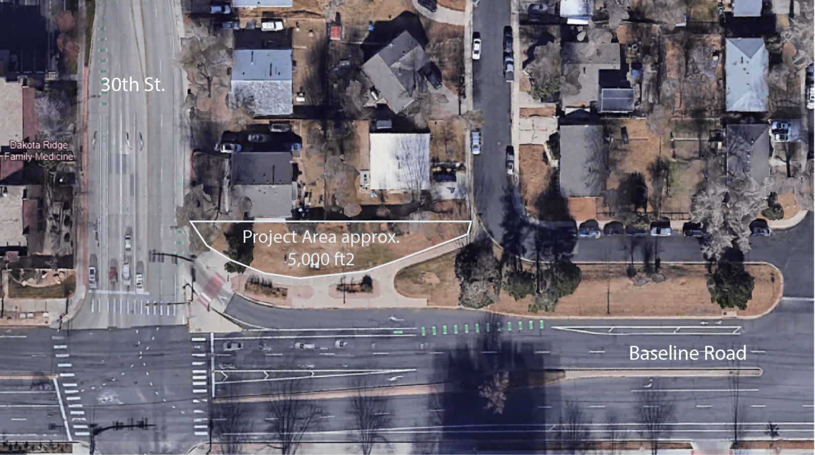 Aerial shot of project location, a section of 5000 square feet of grass at the corner of an intersection next to two houses