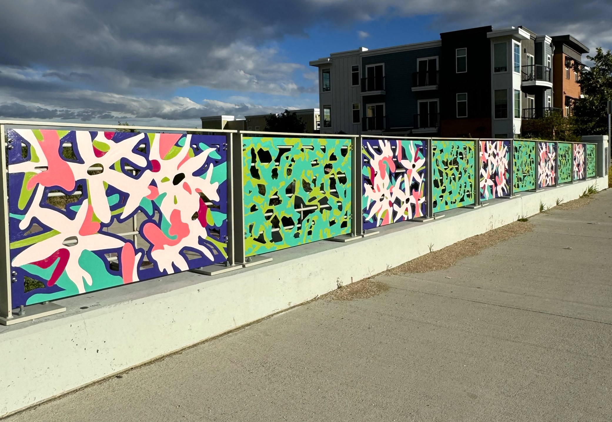 Colorful panels on a bridge along Broadway Avenue