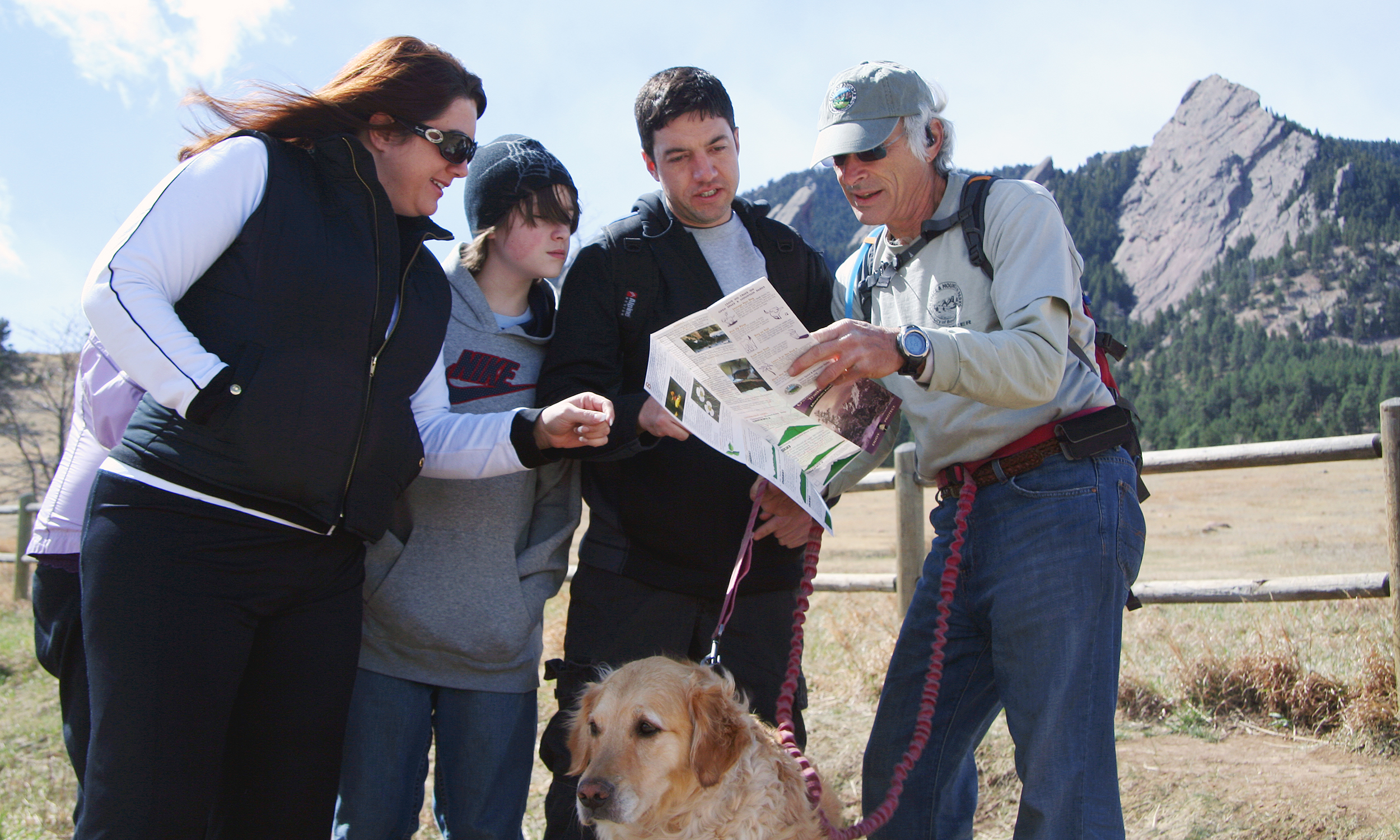 An OSMP trail guide helps visitor on the Chautauqua Trail