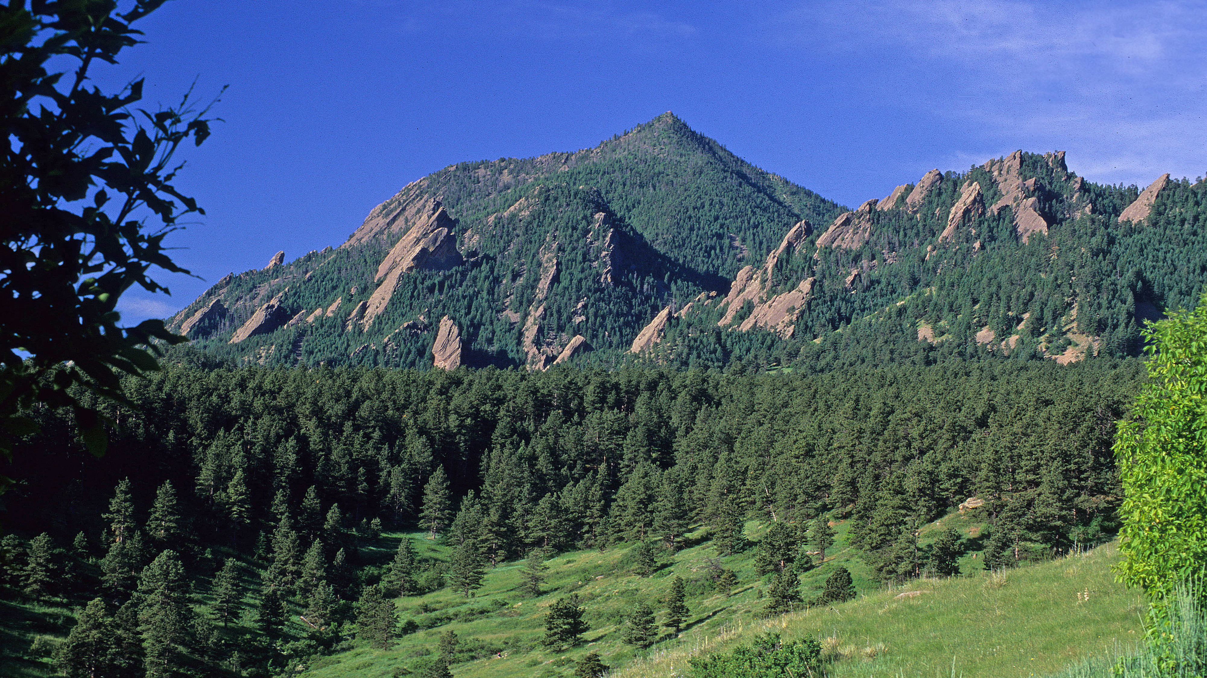 Boulder Flatirons and hills along the city's mountain backdrop