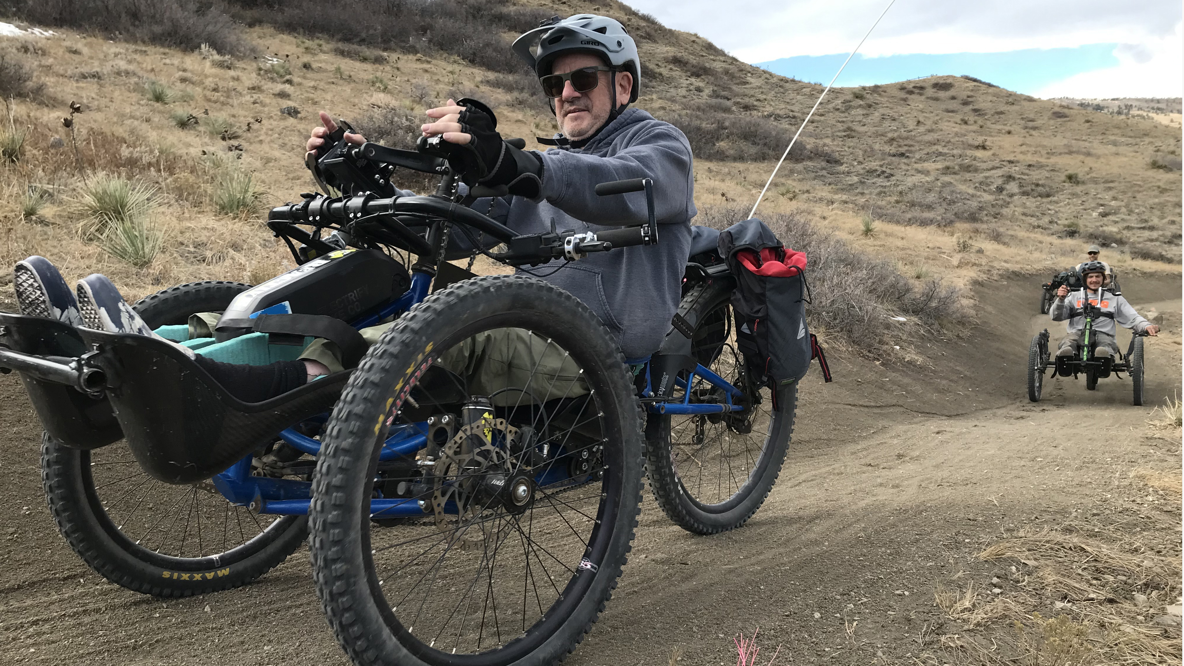 An adaptive bike rider enjoys open space trails