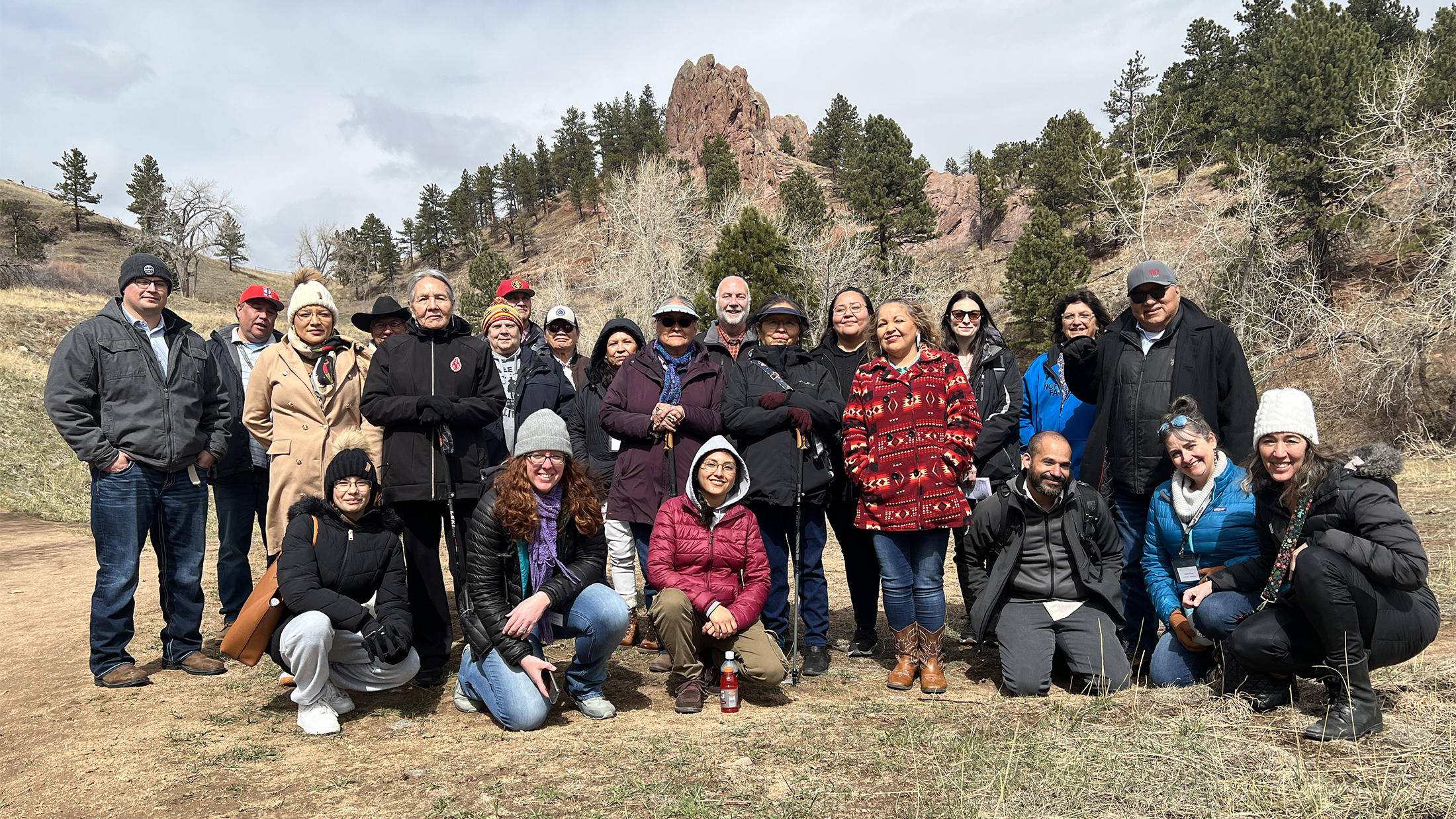 Tribal Representatives, staff and Council members stand in The Peoples' Crossing during a tribal consultation