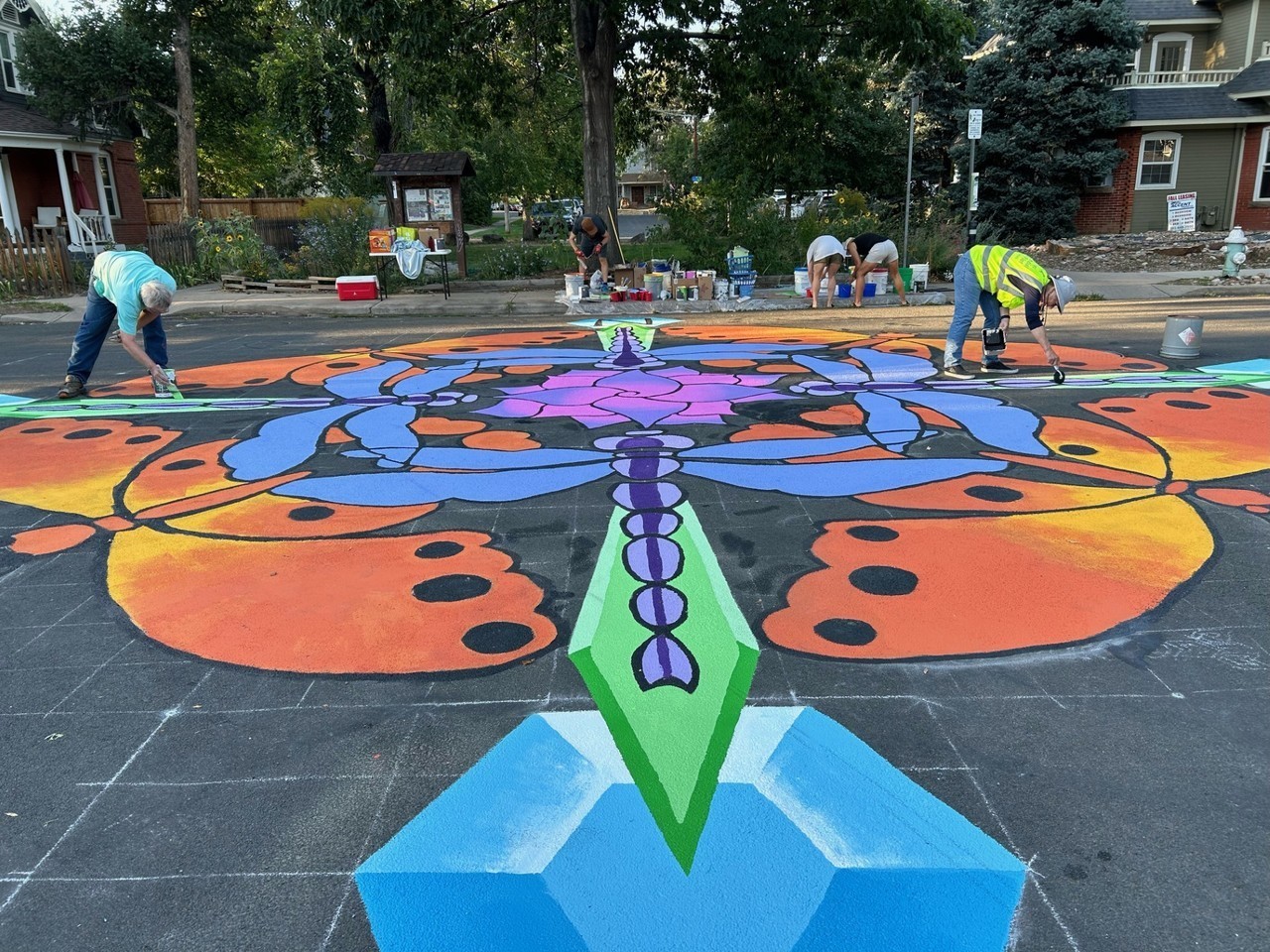 Artists painting a Goss Grove Street Mural