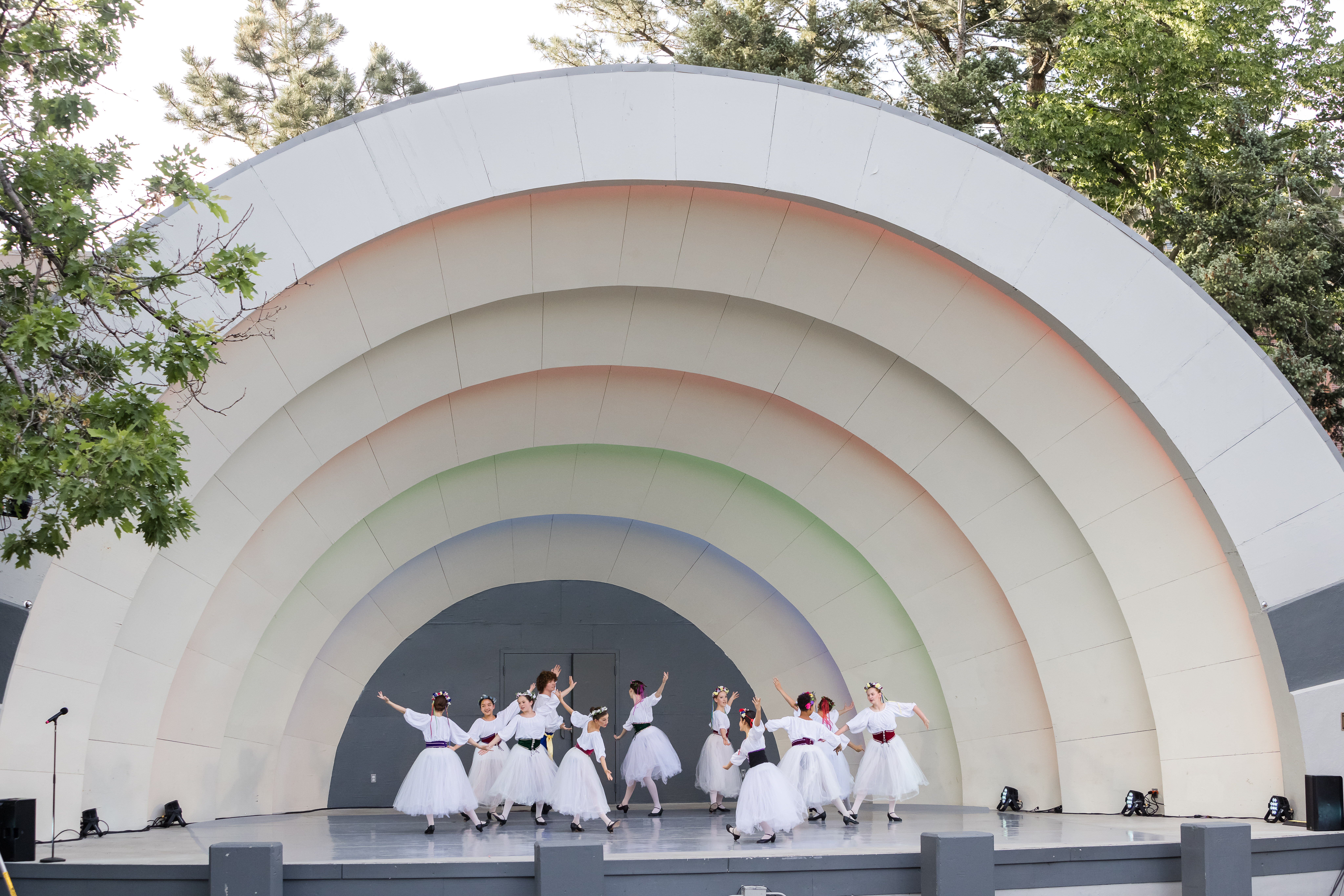A group of ballet dancers dance together on the Bandshell.