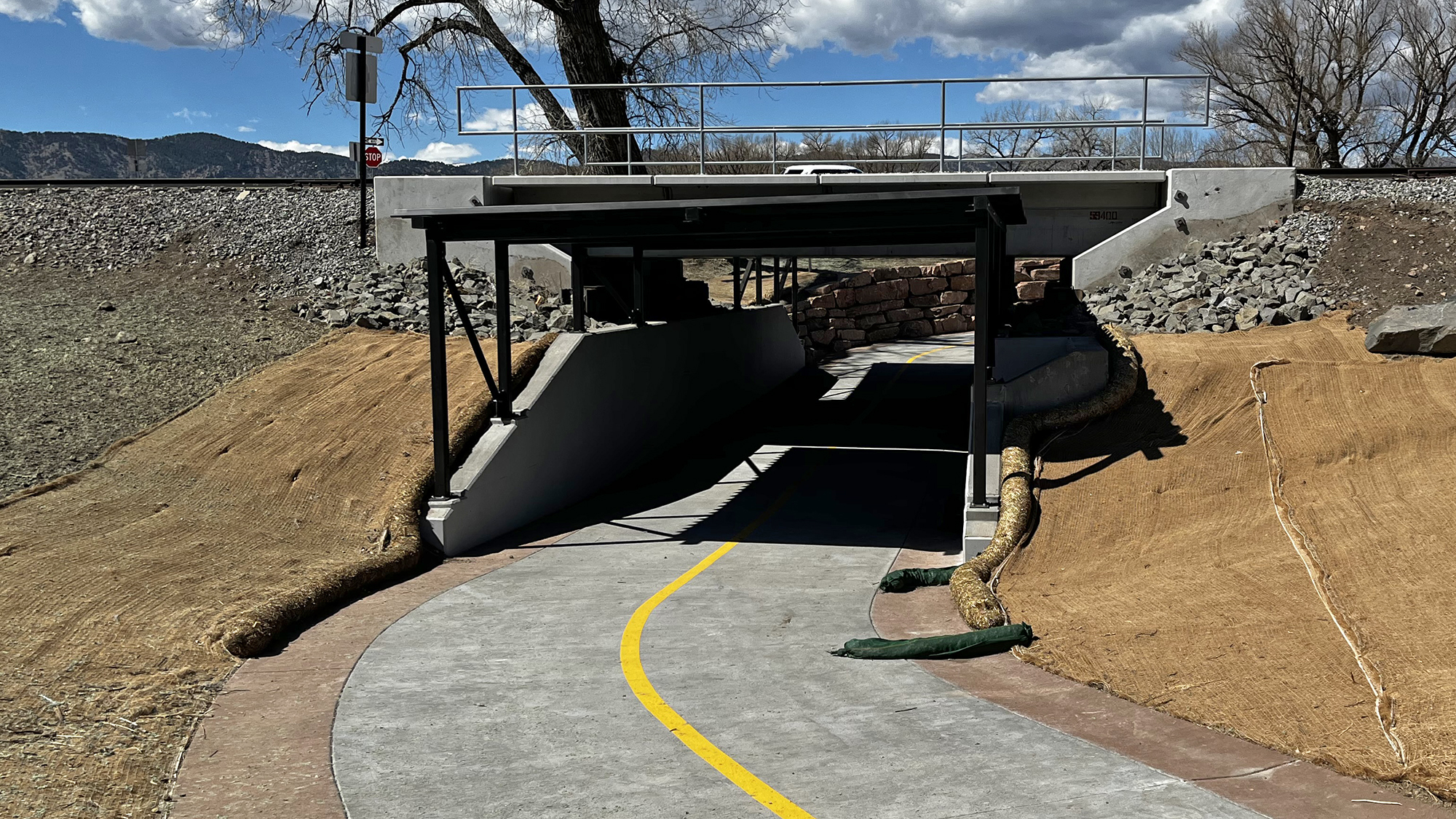 A paved path goes through the new Four Mile Canyon Creek Trail Underpass