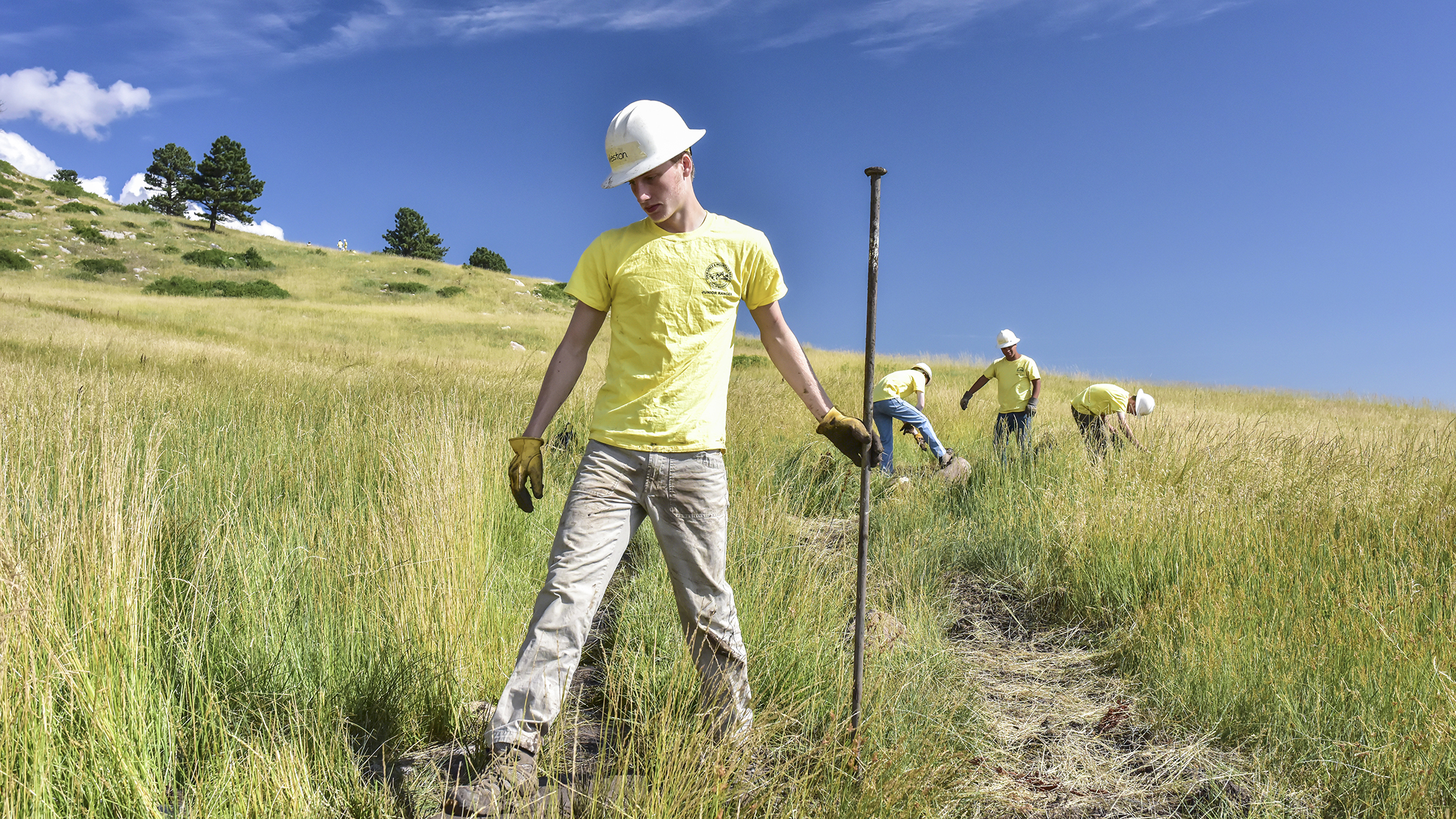 Junior Ranger works on the land near Hogback Trail in north Boulder