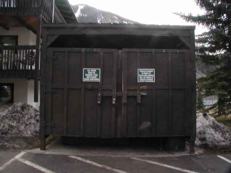 An example of a not-recommended waste enclosure. The large gaps at the top and bottom allow bears to enter. 