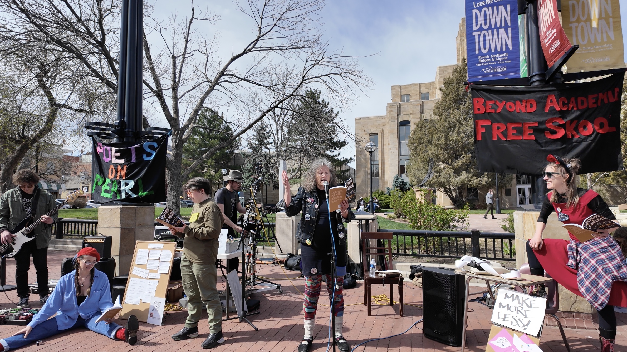 Photo of Beyond Academia Free Skool performing poetry. 