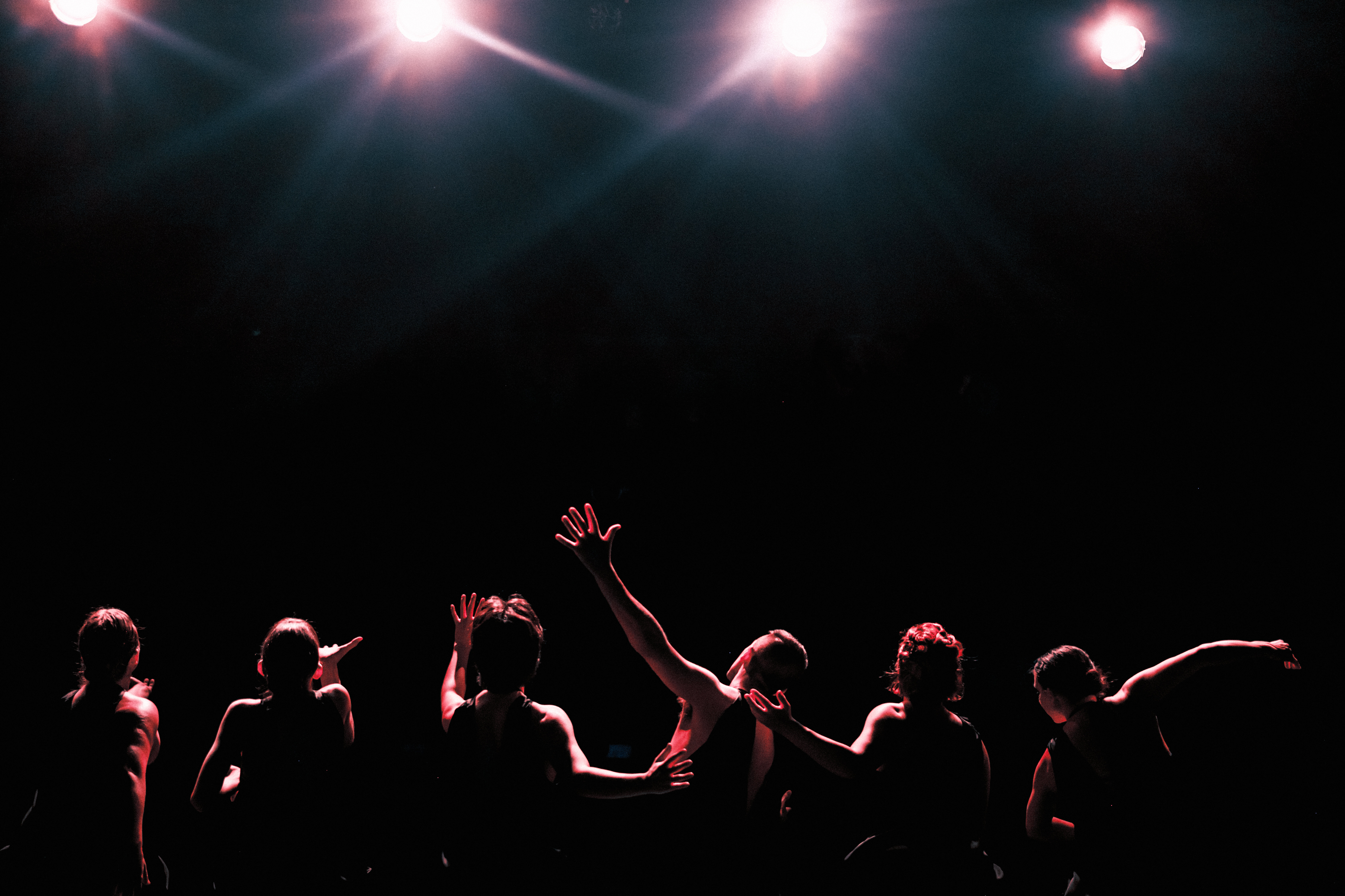 Silhouette of dancers on a stage