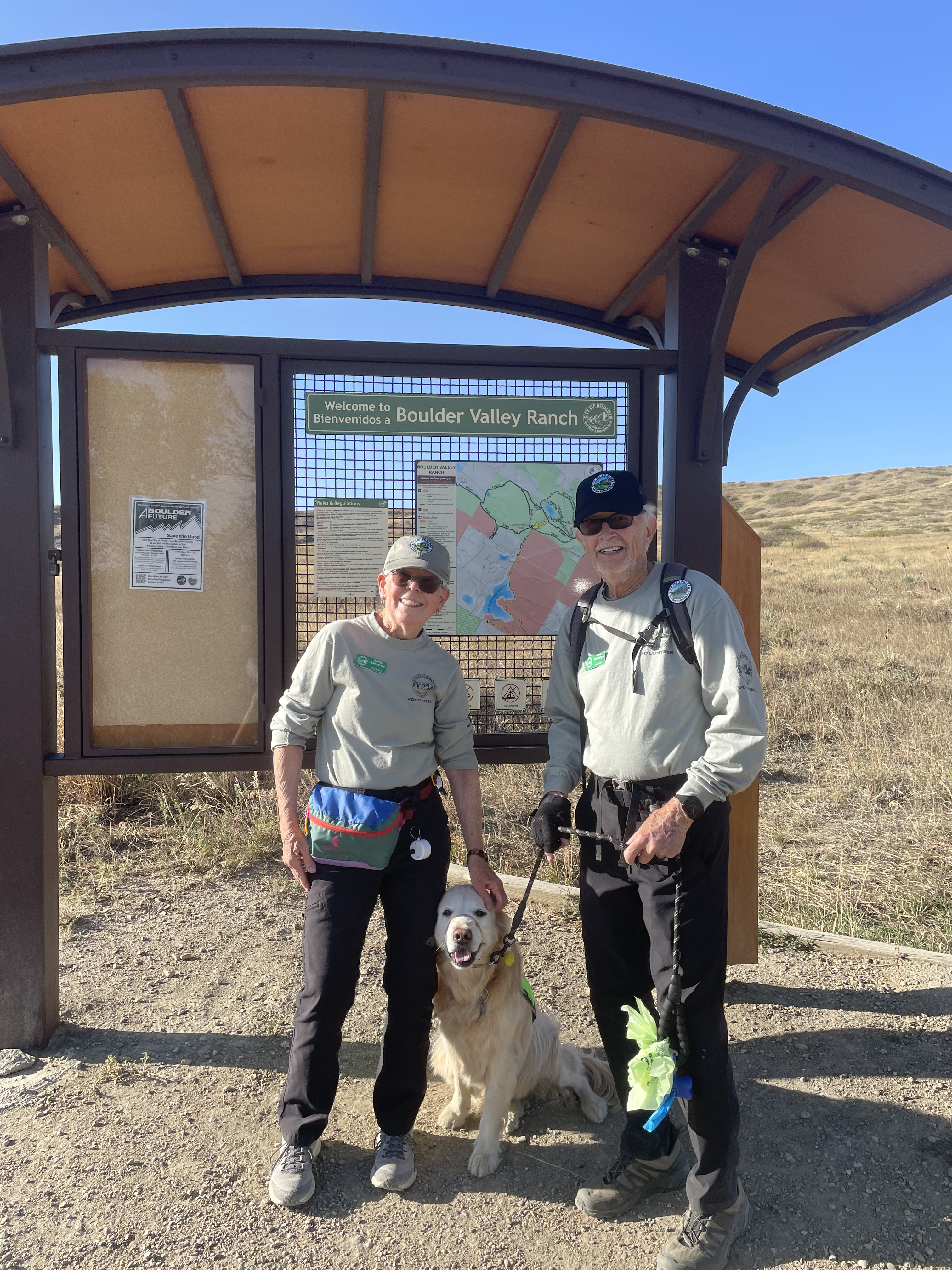 OSMP Dog Ambassadors, Sandy and Buzz Bainbridge, and their dog.