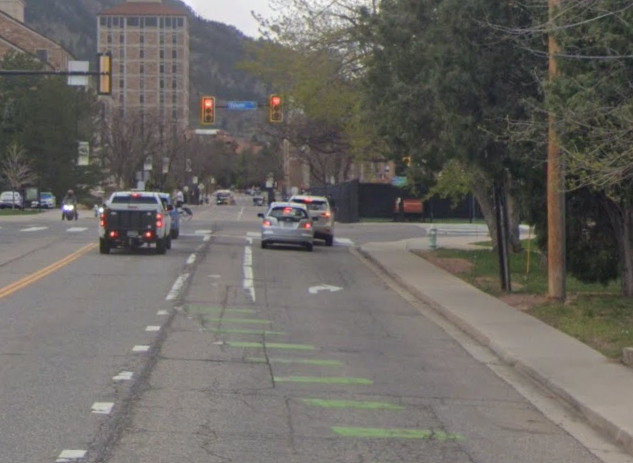 Before 2025 mobility enhancements, the vehicle right-turn lane on Colorado Avenue intersects with the westbound bike lane just east of the Folsom Street intersection.