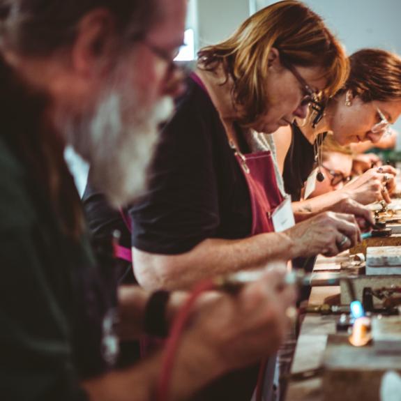 Students taking a metalworking class