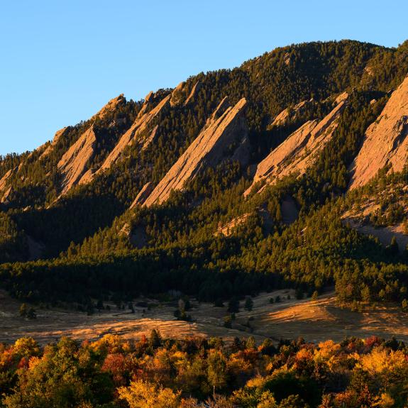 Boulder's Flatirons with fall foliage