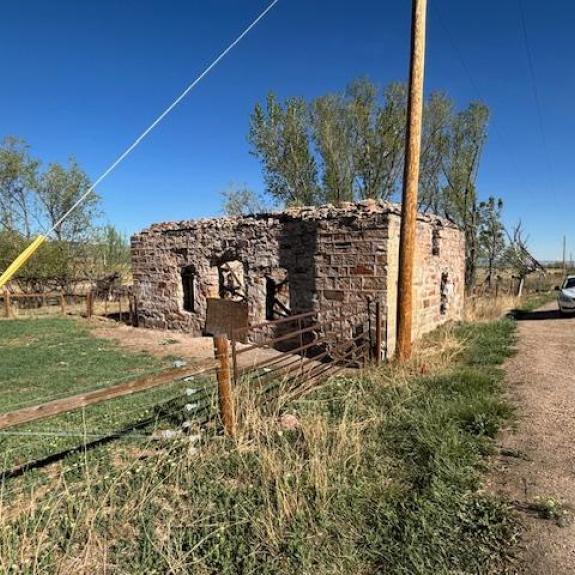 Small brick building with no doors or windows.