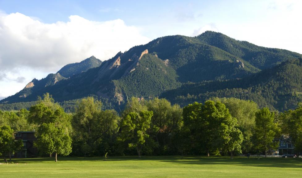 View of Flatirons from the north rising above Boulder, Colorado