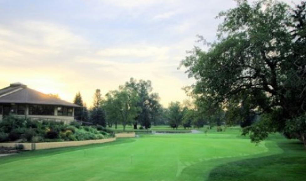 A view of the current clubhouse and green at the Flatirons Golf Course