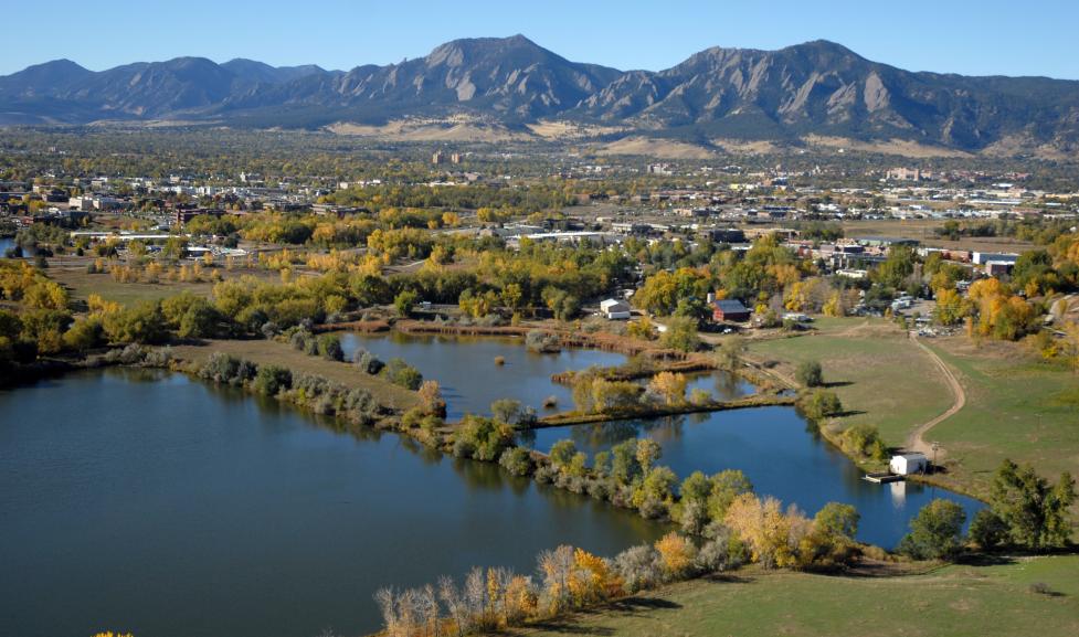 View of Boulder Flatirons in the background and the city of Boulder in the foreground