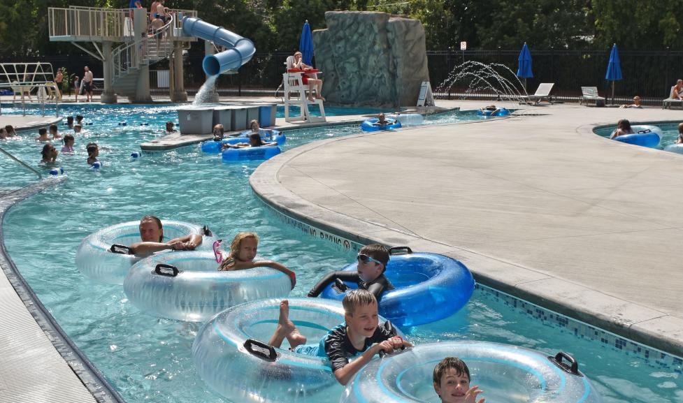 Kids playing the lazy river with tubes