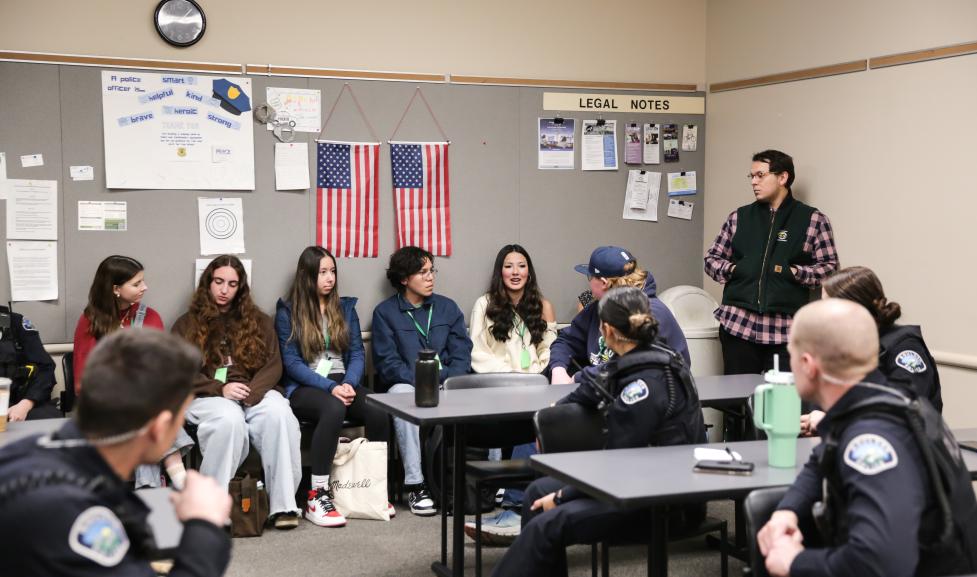 Youth and police officers meet during a briefing