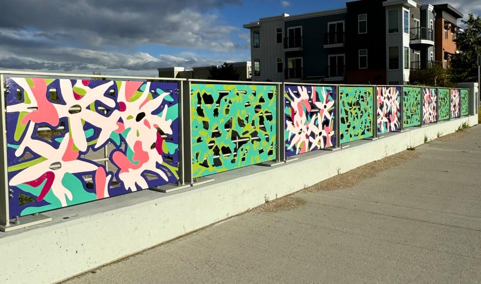 Photo of Broadway Ave. overpass with Sharon Dowell's art on the bridge railings