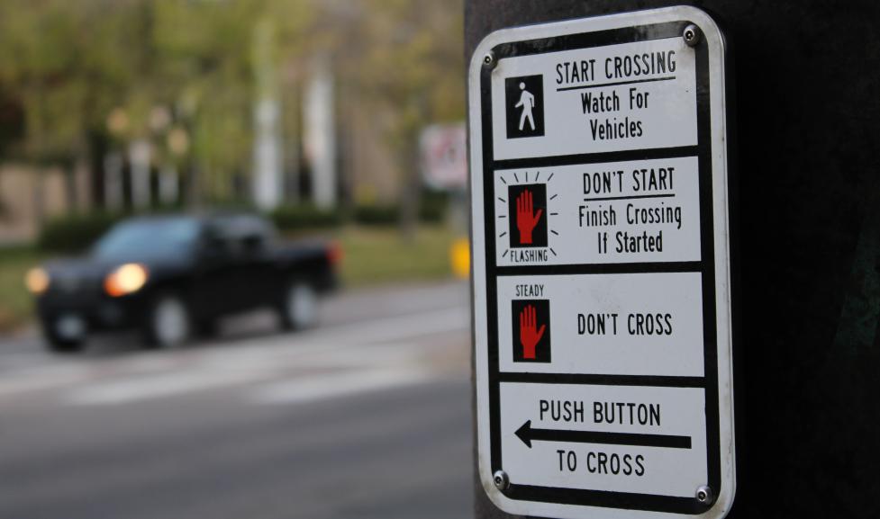 Traffic pole button sign