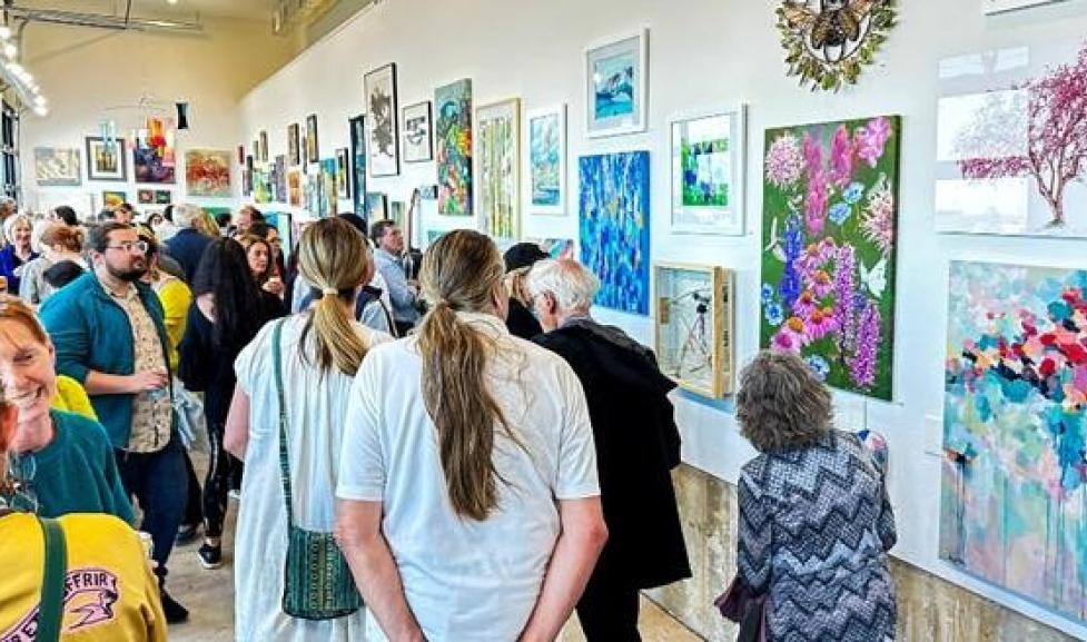 Attendees of Boulder Arts Week looking at an exhibit