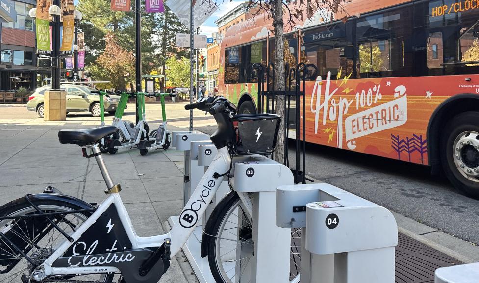 BCycle, lime e-scooters and HOP bus traveling downtown