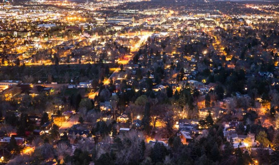 boulder with lights on at night