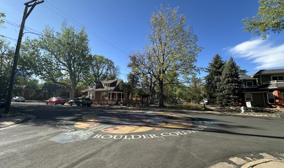 Cul-de-sac and street on Goss Grove with chalk painting in the center.