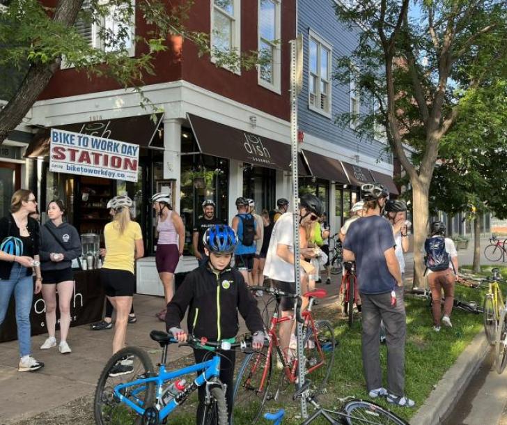 Bicyclists enjoying free breakfast at a vendor on Pearl Street on Walk and Bike to Work Day