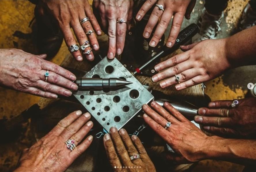 Metalsmiths showing their rings on hands