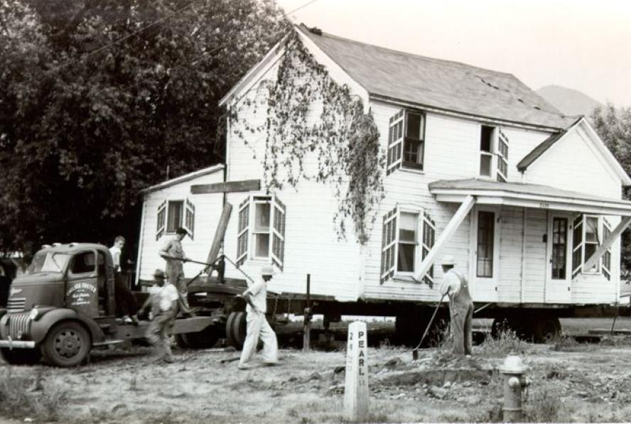 2436 Pearl Street: House being moved on a flatbed truck. Circa 1952. Boulder Historical Society/Museum of Boulder. 