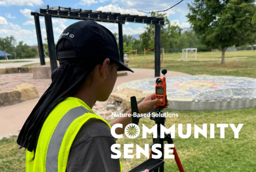 Community Forestry Corps member measuring heat in a park