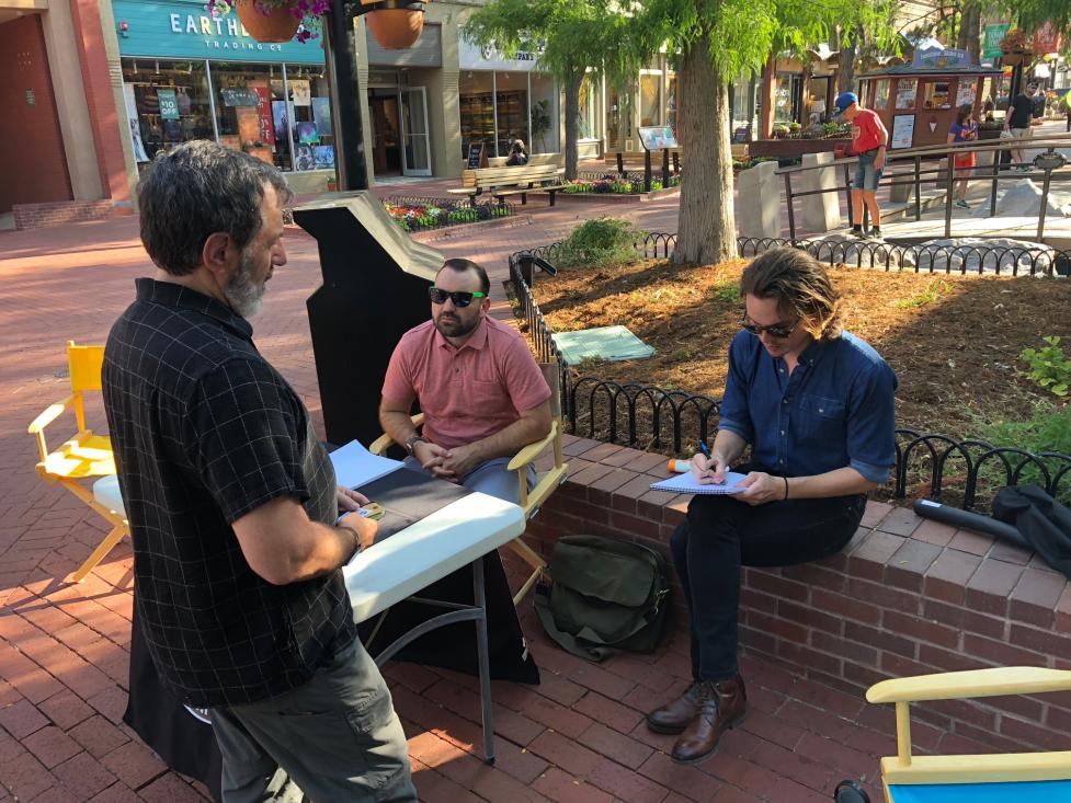 Collecting feedback from the public on the city website at a pop-up event on Pearl Street in 2018.