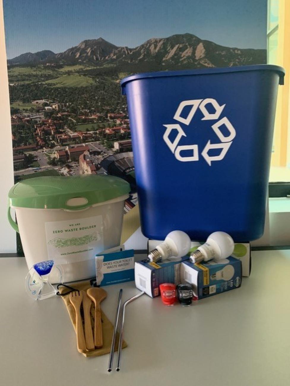 An EcoVisits EcoKit includes a compost bin, recycle bin, LED lightbulbs, reusable cutlery and metal straws