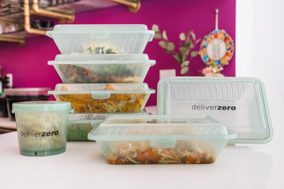 Stack of DeliverZero reusable food containers