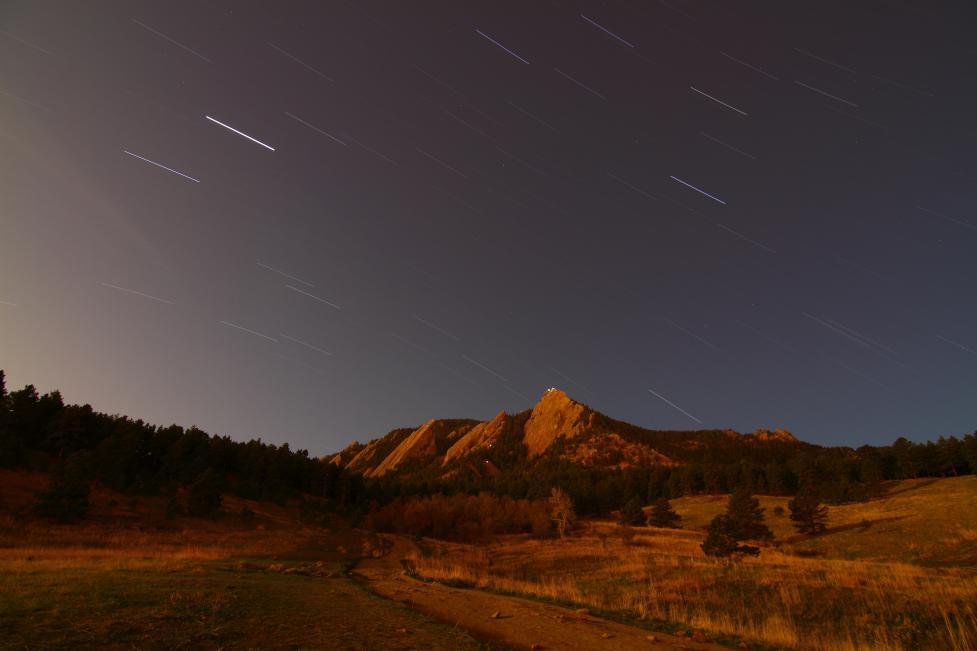 Boulder flatirons at night with a starry sky