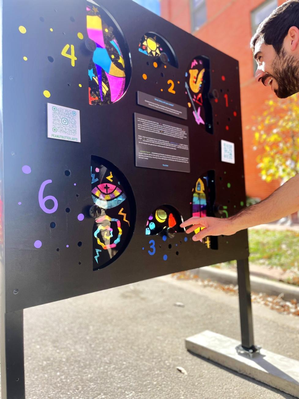 Community member interacting with an art project in the street.