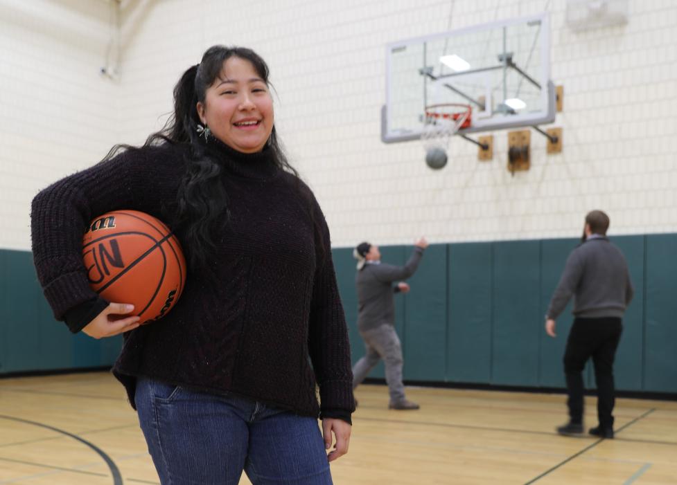 Alma Garcia, Youth Services Coordinator with Boulder Parks & Rec, holding a basketball